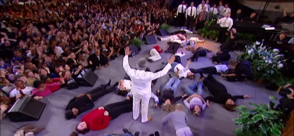 people-prostrate-on-stage-v=4QDAC4JjTjg.jpg