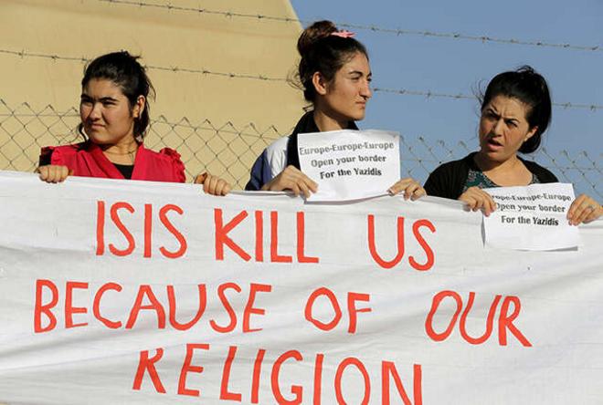 Yazidis hold banner